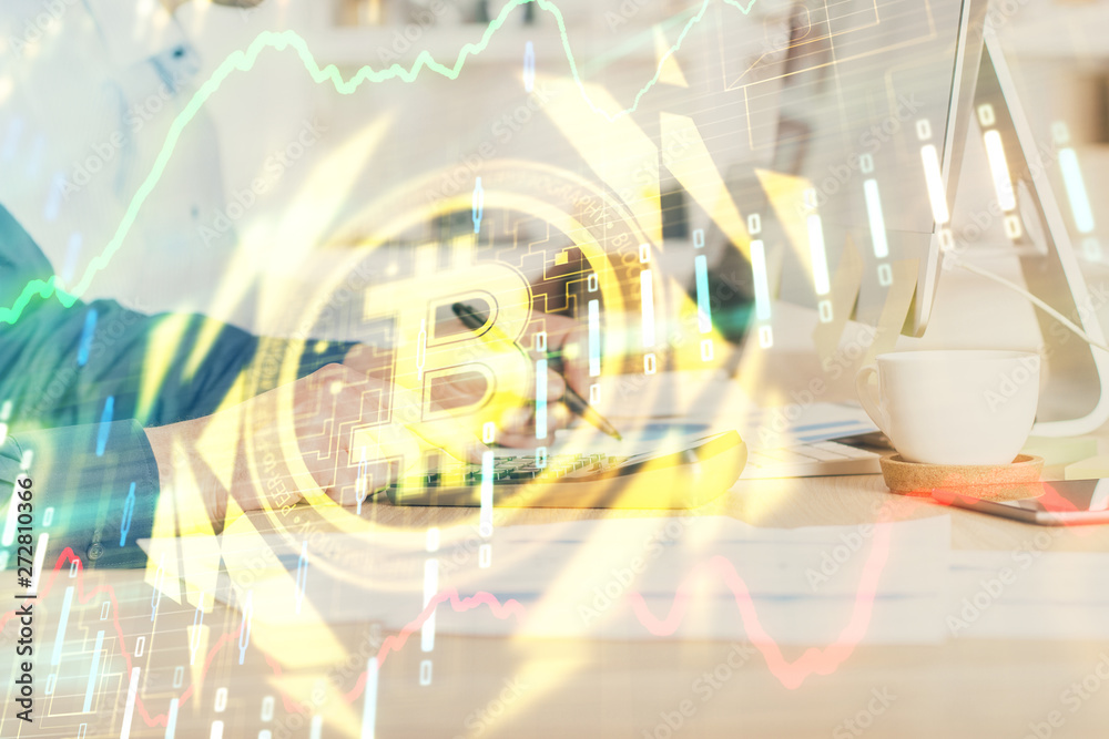 Crypto currency theme hologram with businessman working on computer on background. Concept of blockchain. Double exposure. Crypto currency theme hologram with businessman working on computer on background. Concept of blockchain. Double exposure.