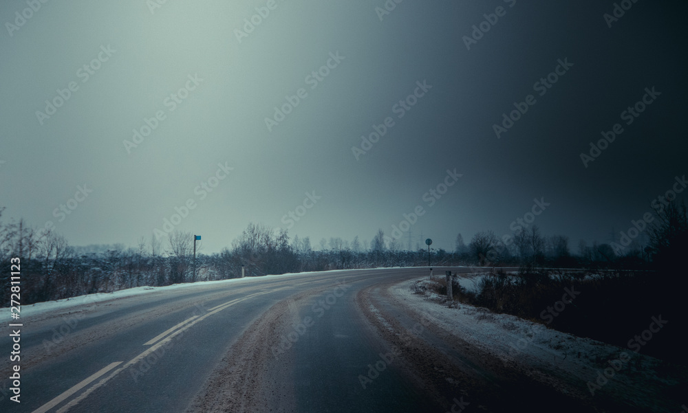 Winter Russian asphalt road. Winter road. Snowy road. Journey .