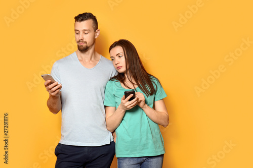 Young couple with mobile ph...