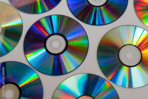 Vintage CD or DVD disk background  old circle discs used for data storage  share movies and music