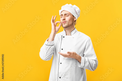 Handsome male chef on color...