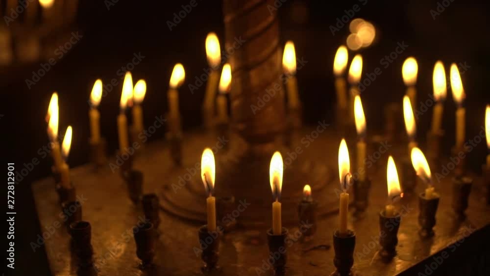 candles are lit on the candlestick in the church candles are lit on the candlestick in the church