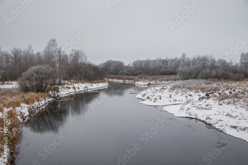 Winter landscape on the river. Snow picture. Snow and river. Cloudy snow day. © alenka2194