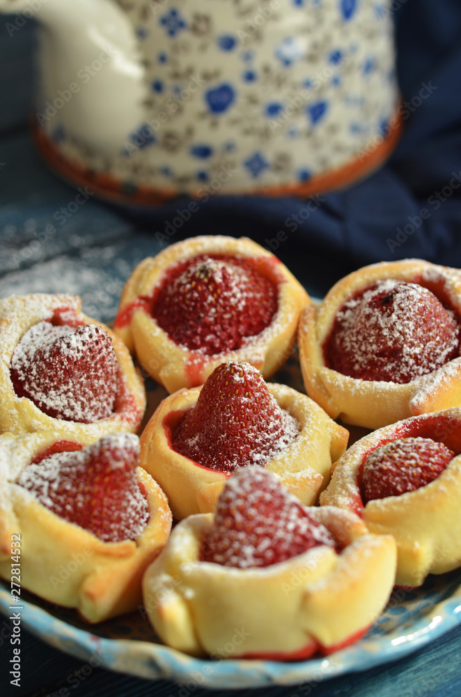 Cookies with strawberries on a rustic saucer Cookies with strawberries on a rustic saucer