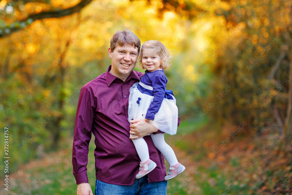 Happy young father having fun cute toddler daughter, family portrait together. man with beautiful baby girl in nature and forest. Dad with little child outdoors, hugging. Love, bonding. Happy young father having fun cute toddler daughter, family portrait together. man with beautiful baby girl in nature and forest. Dad with little child outdoors, hugging. Love, bonding.
