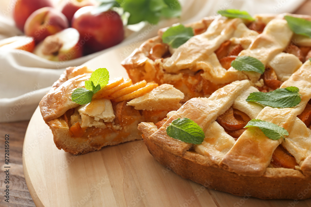 Tasty peach pie on table, closeup