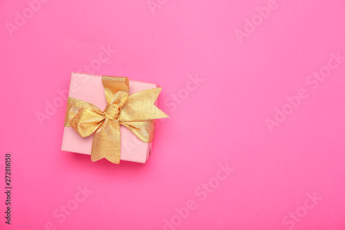 Beautiful gift box on color background © Pixel-Shot