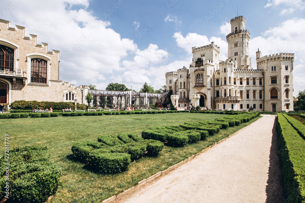 Fototapeta premium Hluboka nad Vltavou, Czech Republic, MAY 4, 2018 - the ensemble of the white castle Hluboka nad Vltavou and the park in sunny weather. The architectural ensemble in the Czech Republic.