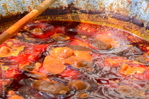 Traditional hungarian food, pork stew in cauldron. close-up