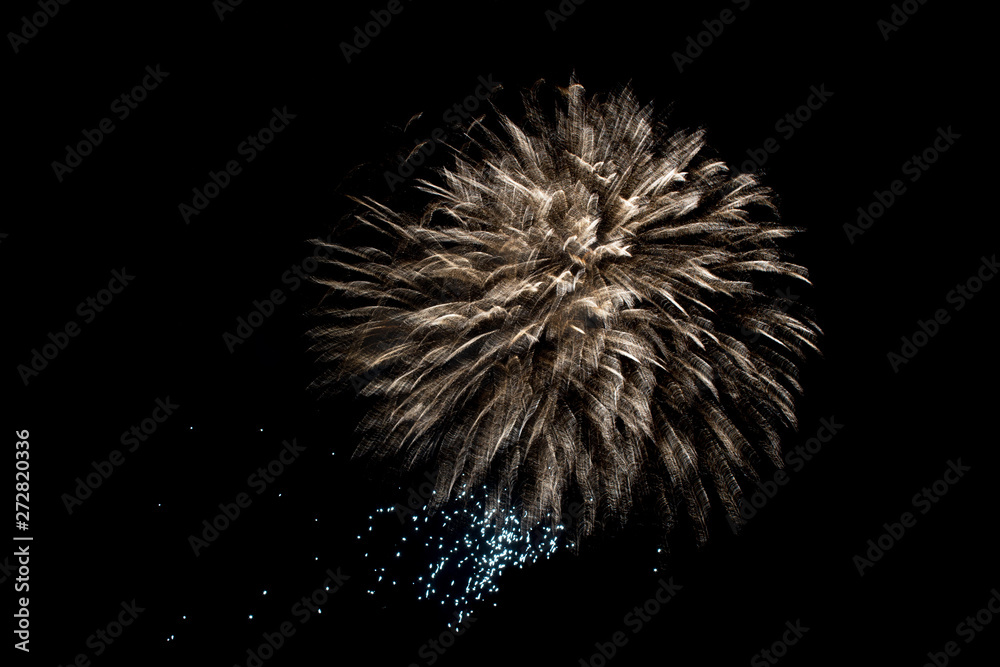 fireworks golden ball explosion in the night holiday sky