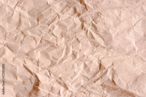 Backgrounf of old crumpled craft package wrapping paper texture