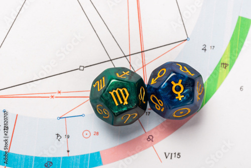 Astrology Dice with zodiac symbol of Virgo Aug 23 - Sep 22 and its ruling planet Mercury on Natal Chart Background photo