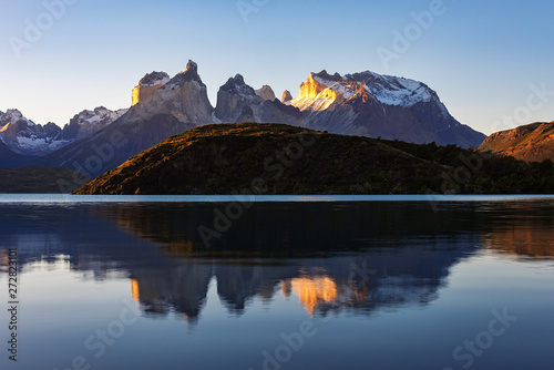 Fantastic mountain landscape. Reflection of mountains in the lake. Sunset view. National Park Torres del Paine, Chile. © dsaprin