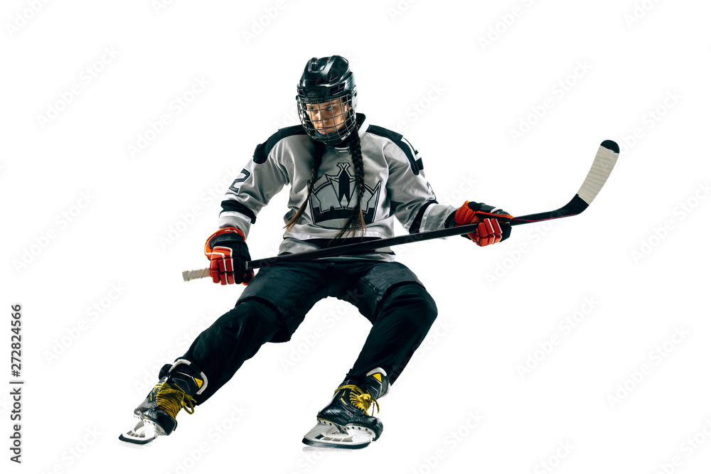 Young female hockey player with the stick isolated on white background. Sportswoman in action wearing equipment attacking for the goal or score. Concept of sport, healthy lifestyle, motion, movement. Young female hockey player with the stick isolated on white background. Sportswoman in action wearing equipment attacking for the goal or score. Concept of sport, healthy lifestyle, motion, movement.