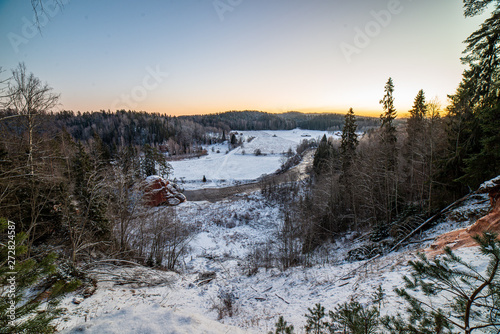 winter surise over countryside fields and forest in cold © Martins Vanags