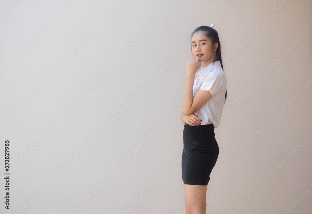 Portrait of thai adult student university uniform beautiful girl relax and smile Portrait of thai adult student university uniform beautiful girl relax and smile