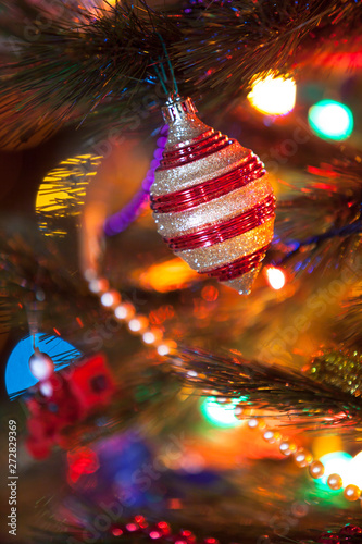 Beautiful original toy whirligig on Christmas tree close-up