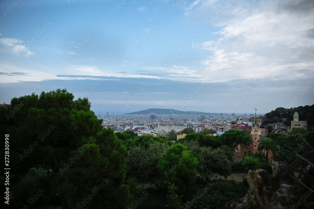 View on Barcelona from Park Guell. Beautiful architecture. Evening sunset panorama.