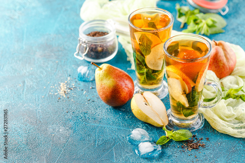 Ice tea with mint leaves and pear