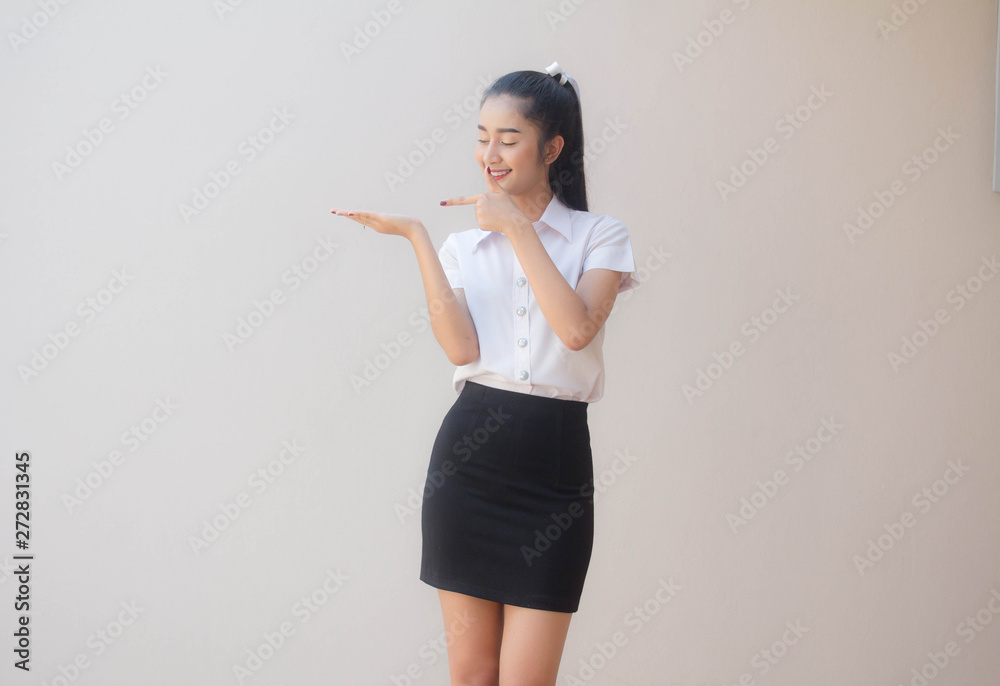 Portrait of thai adult student university uniform beautiful girl show hand Portrait of thai adult student university uniform beautiful girl show hand