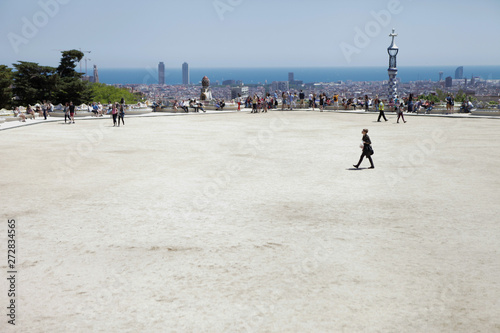 Park Guell Barcelona. Gaudi experience in Spain. Multicolor ceramic tiles. Blue sky, summer day. Vacation and traveling in Catalonia. 