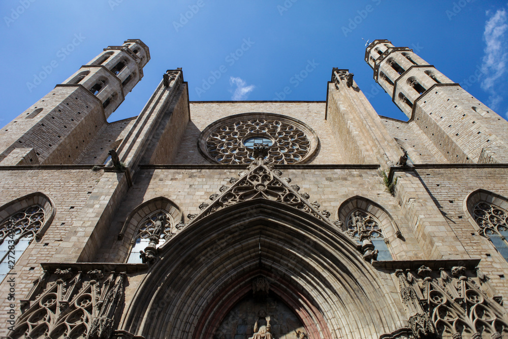 Santa Maria del Mar church in Barcelona. Medieval facade. Bricks and blue sky. Spanish architecture. Santa Maria del Mar church in Barcelona. Medieval facade. Bricks and blue sky. Spanish architecture.