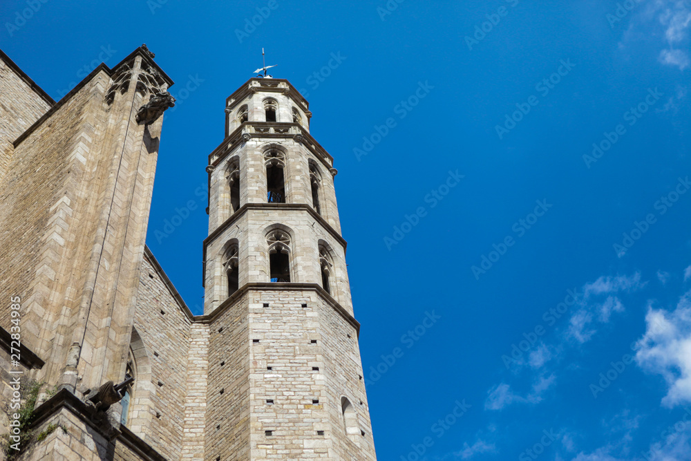 Santa Maria del Mar church in Barcelona. Medieval facade. Bricks and blue sky. Spanish architecture. 