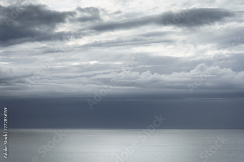 cloudscape with beautiful clouds over the sea © mimadeo