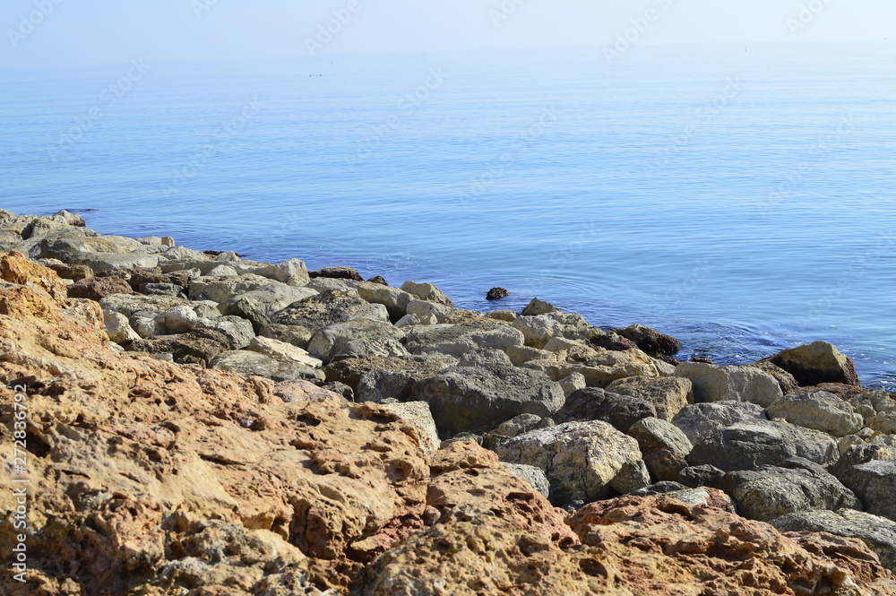 Rocky coastline with a bright turquoise color of the Mediterranean Sea in Spain Rocky coastline with a bright turquoise color of the Mediterranean Sea in Spain