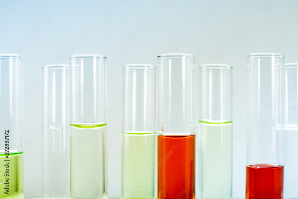Multiple test tubes packed with chemicals, close-ups, background Multiple test tubes packed with chemicals, close-ups, background