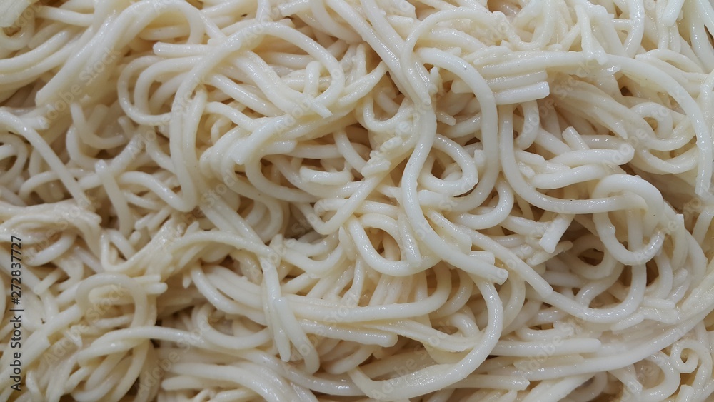 close up view of swirling noodles or spaghetti pasta