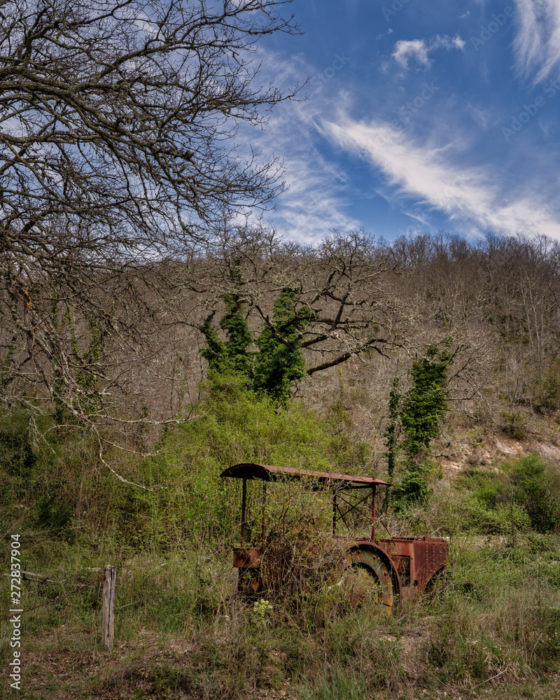 Old rusty tractor at farmland Old rusty tractor at farmland