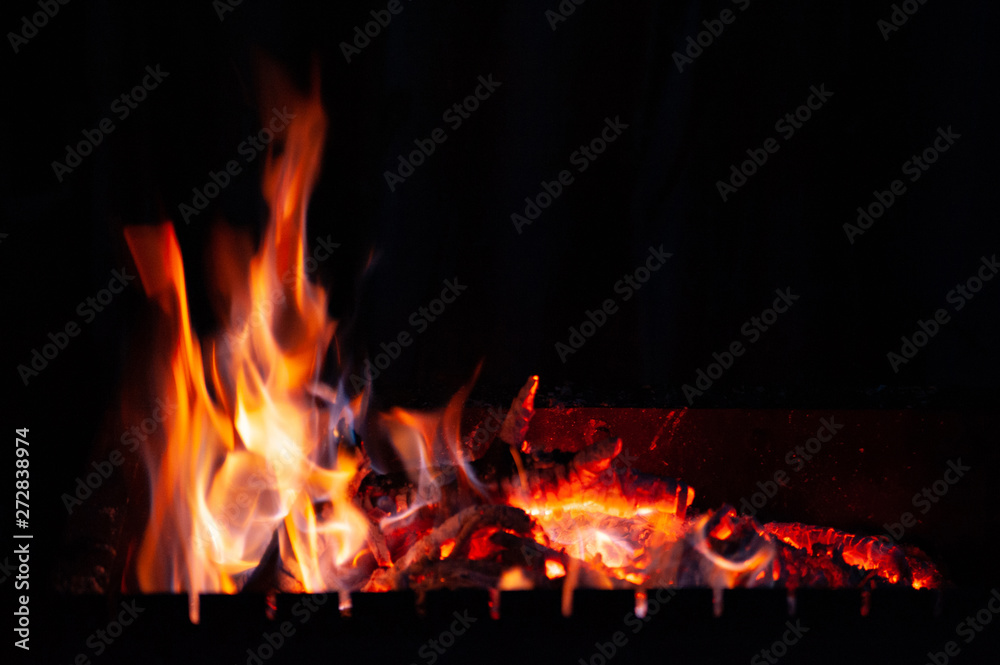 Fire bonfire. The flame of fire burns in an open furnace at night. Fire bonfire. The flame of fire burns in an open furnace at night.