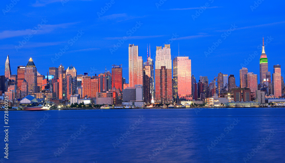 New York City skyline at dusk reflected in Hudson River, USA