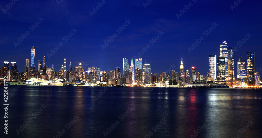New York City skyline at dusk reflected in Hudson River, USA