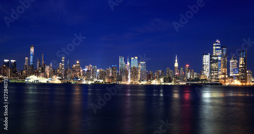 New York City skyline at dusk reflected in Hudson River, USA © vlad_g