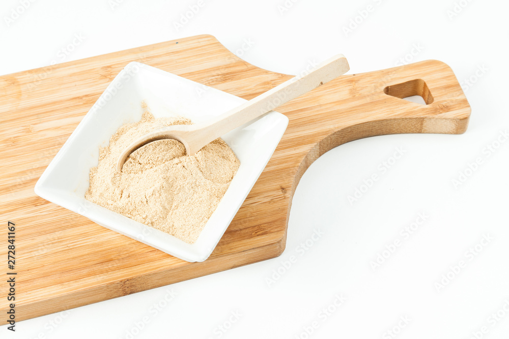 Ginger root powder photo on neutral background
