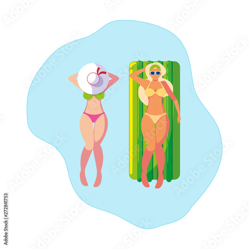 beautiful girls with float mattress floating in water