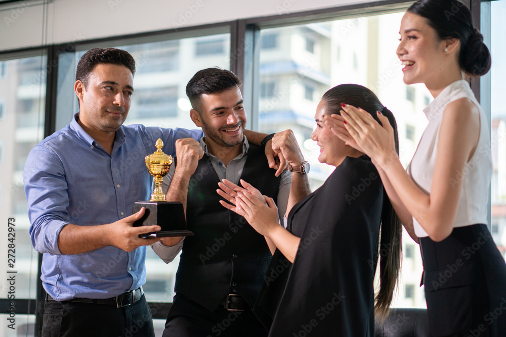 winning business team with a gold trophy award . successful . winning business team with a gold trophy award . successful .