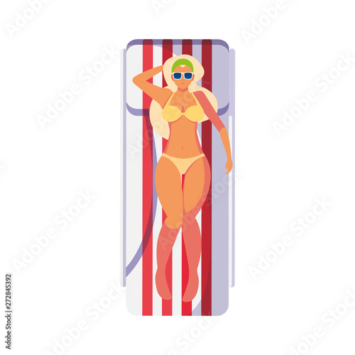 beautiful woman with swimsuit in tanning mat