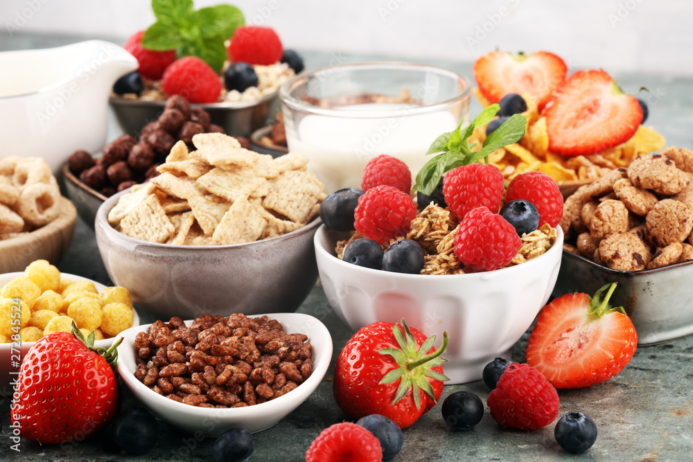 Cereal. Bowls of various cereals, berries and milk for breakfast. Muesli with kids cereals. Cereal. Bowls of various cereals, berries and milk for breakfast. Muesli with kids cereals.