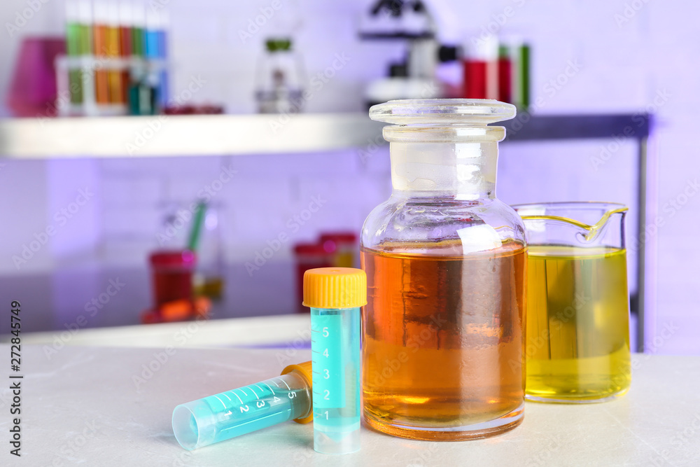 Different glassware with samples on table in chemistry laboratory. Space for text Different glassware with samples on table in chemistry laboratory. Space for text