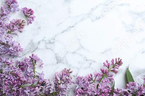Fotografie, Obraz Blossoming lilac flowers on marble table, flat lay
