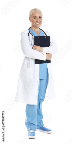 Full length portrait of female doctor with clipboard isolated on white. Medical staff