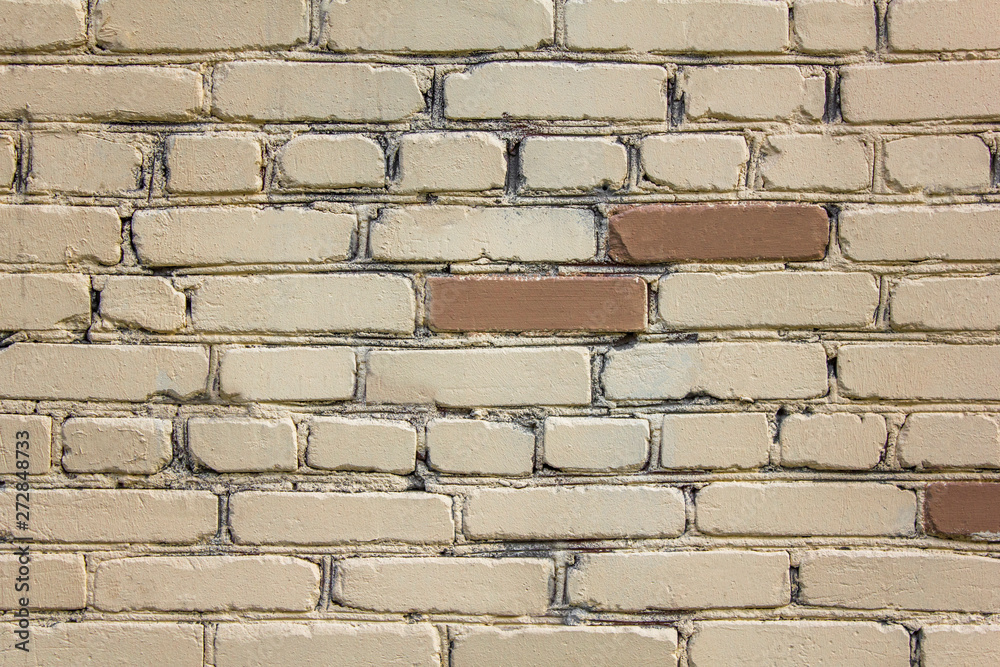 old wall of white and brown bricks. rough surface texture old wall of white and brown bricks. rough surface texture