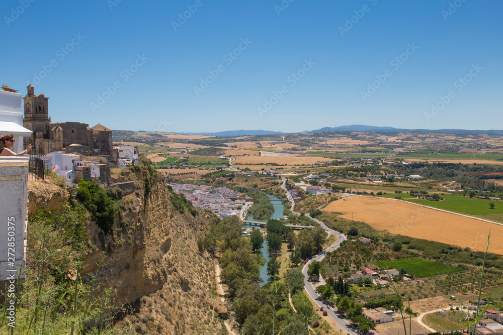 Visitor enjoying impressive sight from viewpoint in Arcos de la Frontera, Cadiz, Andalusia, Spain