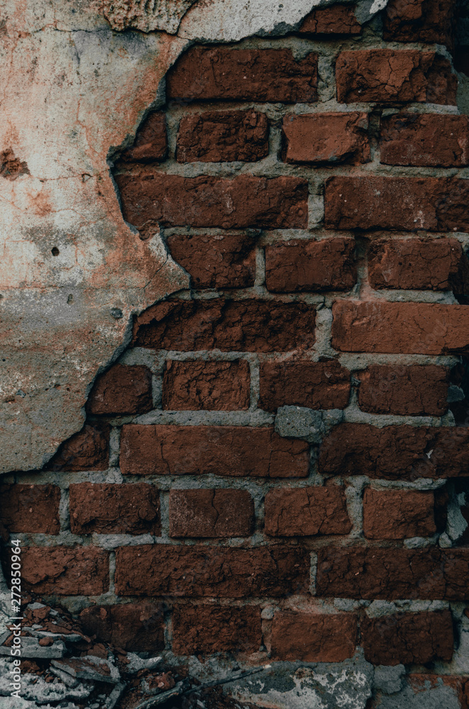 Part of the brick wall of the destroyed house after the earthquake.War and destruction. Part of the brick wall of the destroyed house after the earthquake.War and destruction.