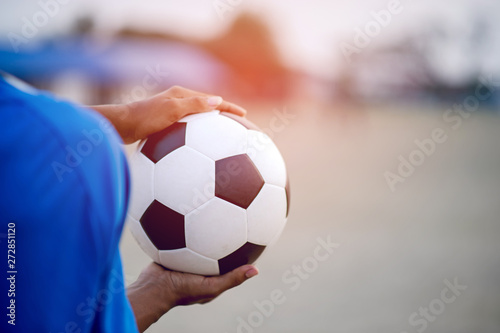 The cropped image of sports players who catch the ball and the football field. Sports-image concept. © FOTO SALE
