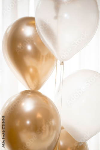 GOLD AND WHITE BALOONS