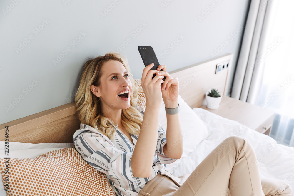 Beautiful young blonde woman relaxing in bed Beautiful young blonde woman relaxing in bed